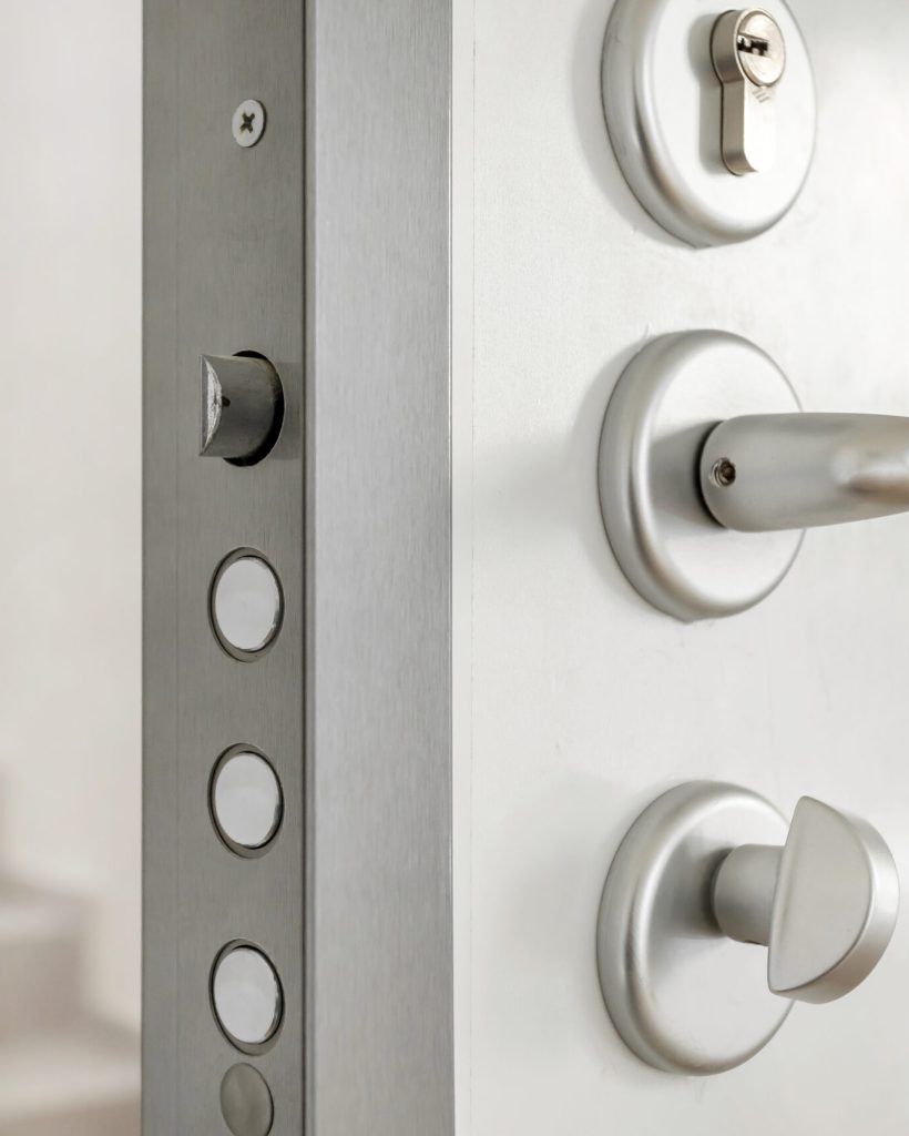 Close-up look at high security lock of an white armored home door